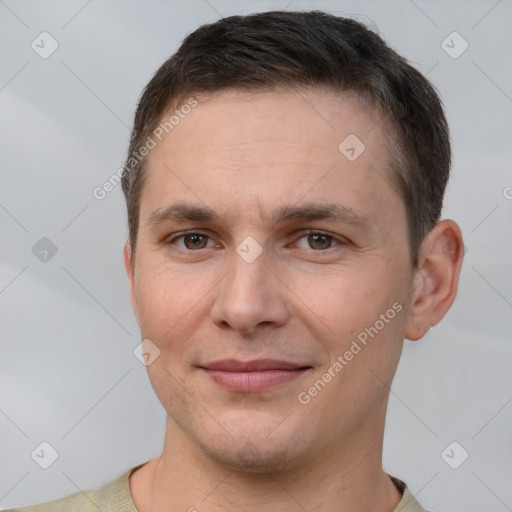 Joyful white young-adult male with short  brown hair and brown eyes