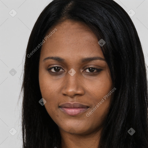 Joyful black young-adult female with long  black hair and brown eyes