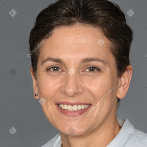 Joyful white adult female with short  brown hair and brown eyes