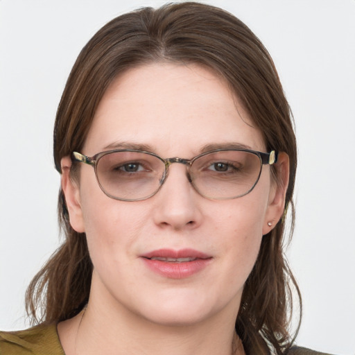 Joyful white young-adult female with medium  brown hair and blue eyes