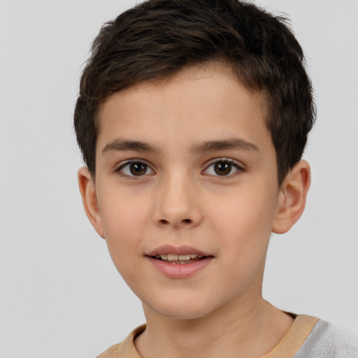 Joyful white child male with short  brown hair and brown eyes