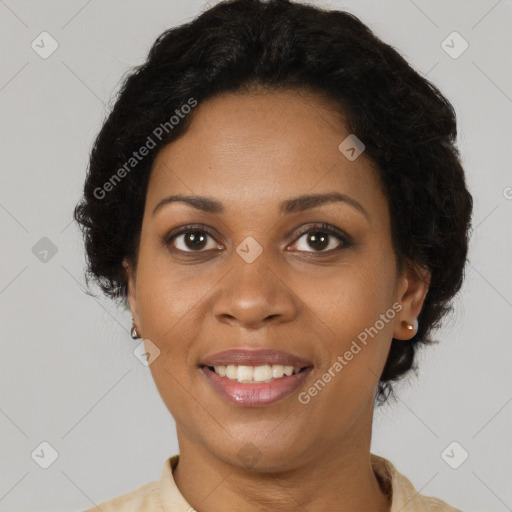 Joyful black adult female with short  brown hair and brown eyes