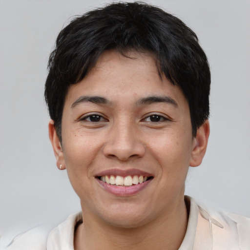 Joyful asian young-adult female with short  brown hair and brown eyes