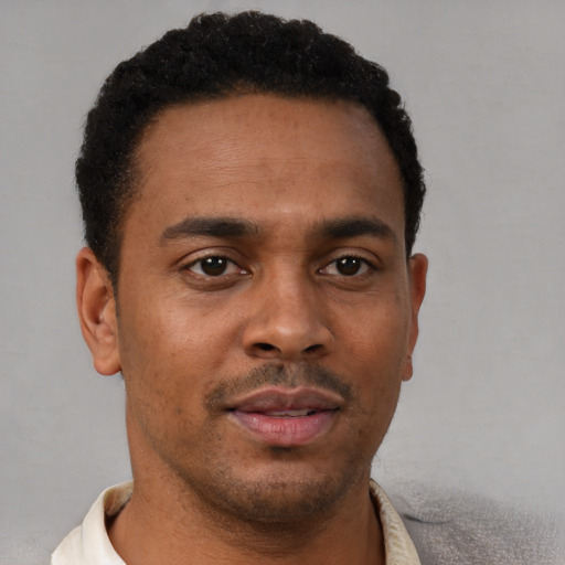 Neutral latino young-adult male with short  brown hair and brown eyes