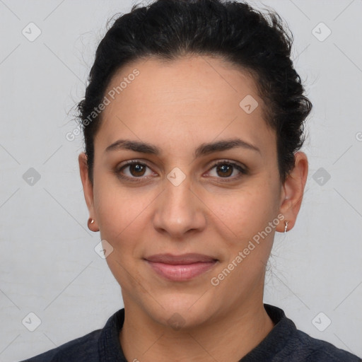 Joyful latino young-adult female with short  brown hair and brown eyes