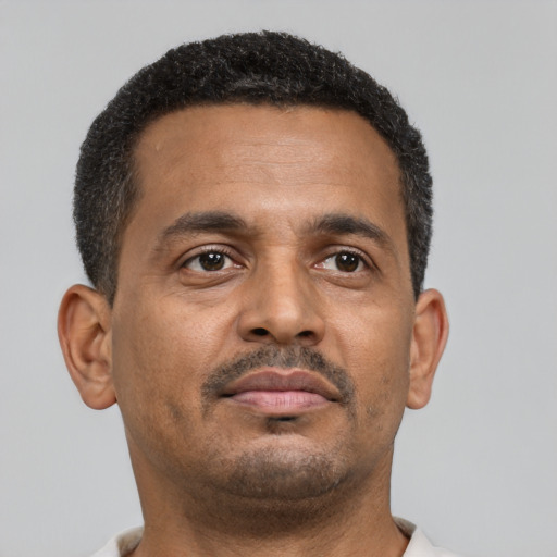 Neutral black young-adult male with short  brown hair and brown eyes