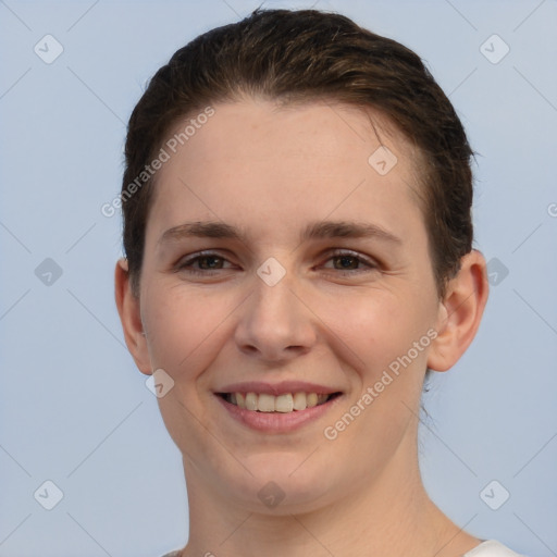 Joyful white young-adult female with short  brown hair and brown eyes