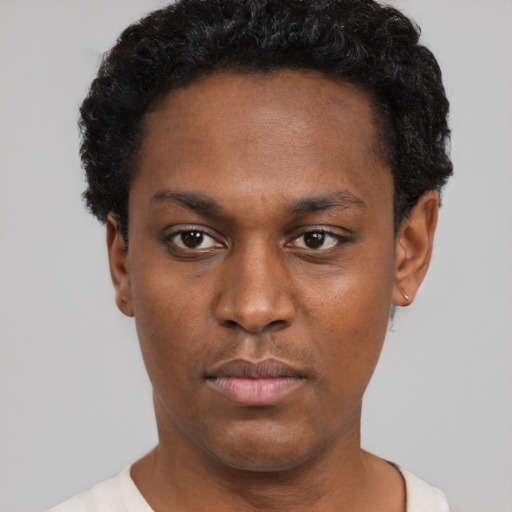 Neutral black young-adult male with short  black hair and brown eyes