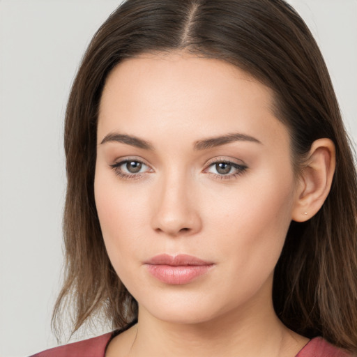 Neutral white young-adult female with long  brown hair and brown eyes