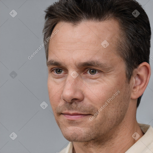 Neutral white adult male with short  brown hair and brown eyes