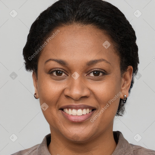 Joyful latino adult female with short  brown hair and brown eyes