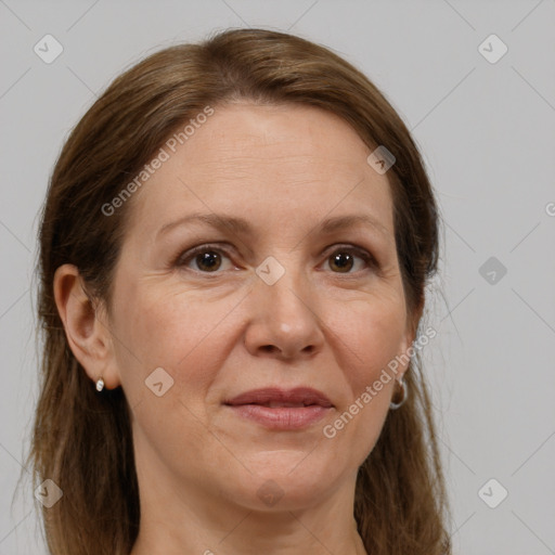 Joyful white adult female with long  brown hair and grey eyes