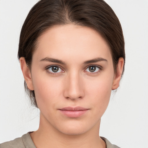 Neutral white young-adult female with short  brown hair and brown eyes