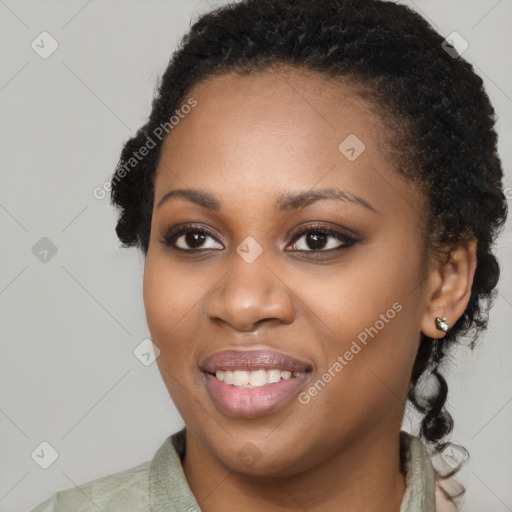 Joyful black young-adult female with medium  black hair and brown eyes