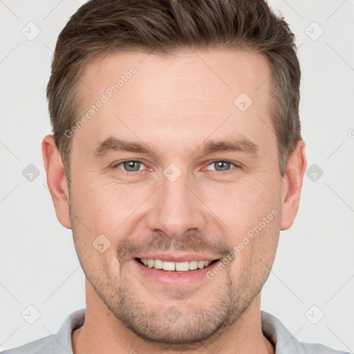 Joyful white young-adult male with short  brown hair and brown eyes