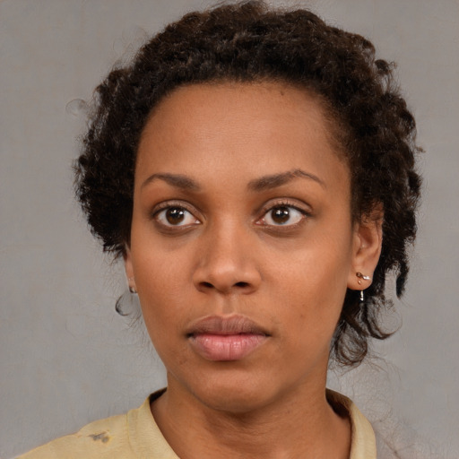 Neutral black young-adult female with short  brown hair and brown eyes