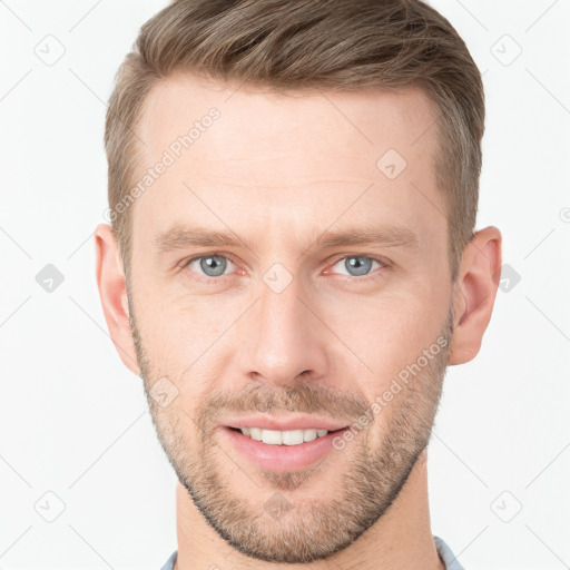 Joyful white young-adult male with short  brown hair and grey eyes