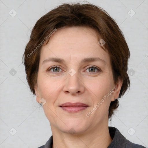 Joyful white adult female with medium  brown hair and grey eyes