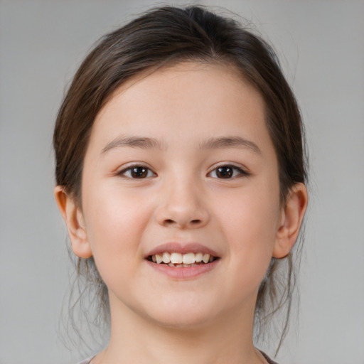 Joyful white child female with medium  brown hair and brown eyes