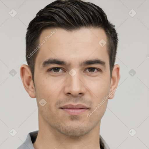 Joyful white young-adult male with short  black hair and brown eyes