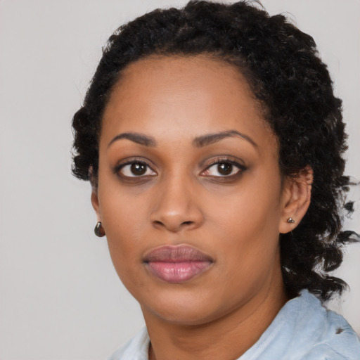 Neutral black young-adult female with medium  black hair and brown eyes