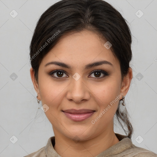 Joyful latino young-adult female with medium  brown hair and brown eyes