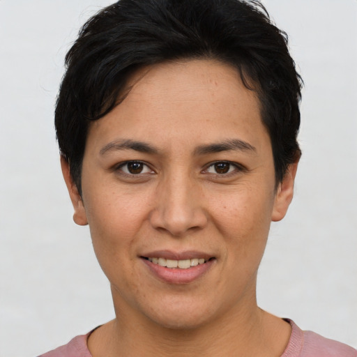 Joyful white young-adult female with short  brown hair and brown eyes