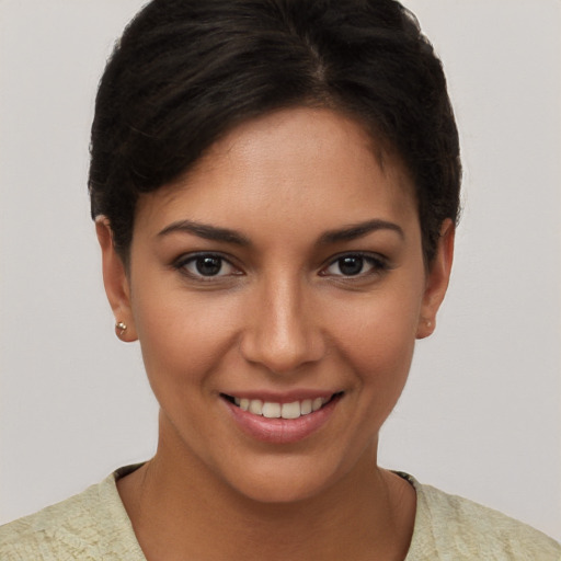 Joyful white young-adult female with short  brown hair and brown eyes