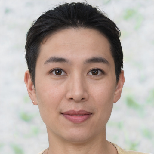 Joyful asian young-adult female with short  black hair and brown eyes