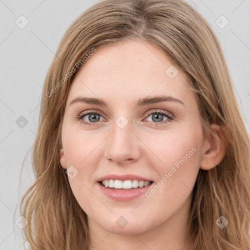 Joyful white young-adult female with long  brown hair and green eyes