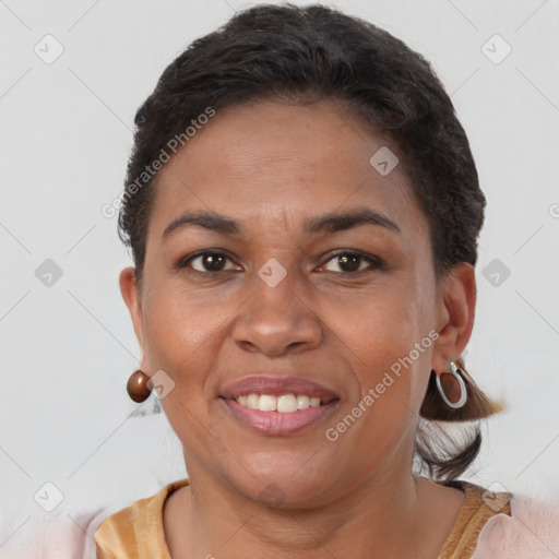 Joyful black young-adult female with short  brown hair and brown eyes