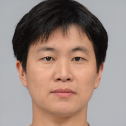 Neutral asian young-adult male with short  brown hair and brown eyes