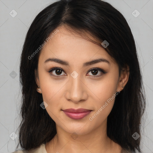 Joyful latino young-adult female with long  brown hair and brown eyes