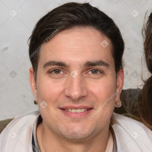 Joyful white adult male with short  brown hair and brown eyes