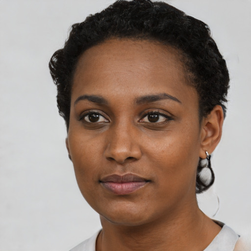 Neutral black young-adult female with short  black hair and brown eyes