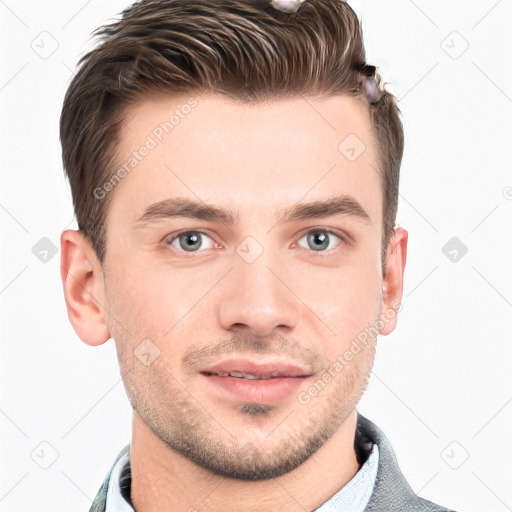 Joyful white young-adult male with short  brown hair and grey eyes