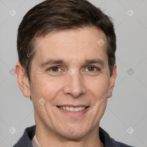 Joyful white adult male with short  brown hair and brown eyes