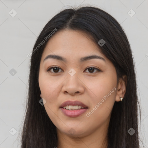 Joyful asian young-adult female with long  brown hair and brown eyes