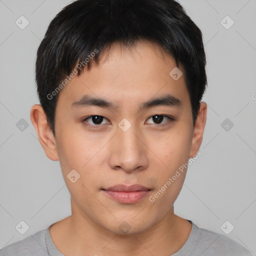 Joyful asian young-adult male with short  black hair and brown eyes