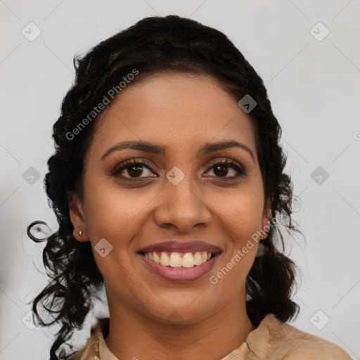 Joyful black young-adult female with long  brown hair and brown eyes