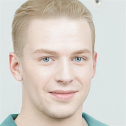 Joyful white young-adult male with short  brown hair and blue eyes