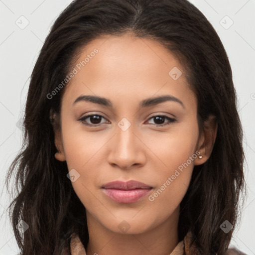 Joyful latino young-adult female with long  brown hair and brown eyes