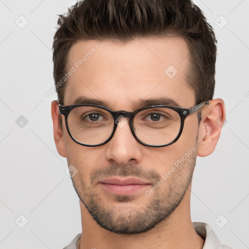 Neutral white young-adult male with short  brown hair and brown eyes