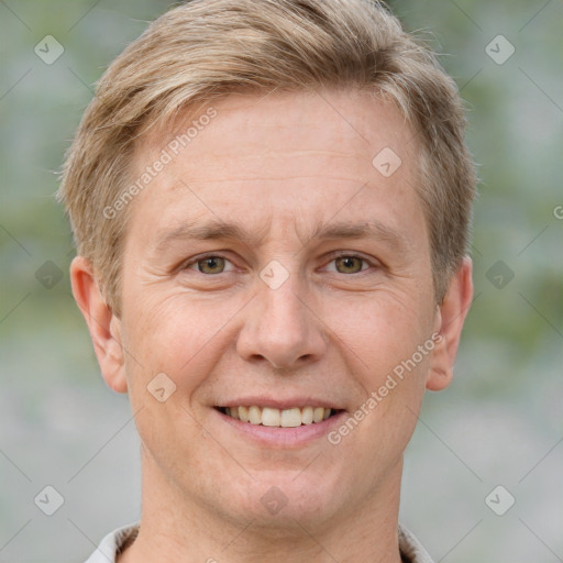 Joyful white adult male with short  brown hair and grey eyes