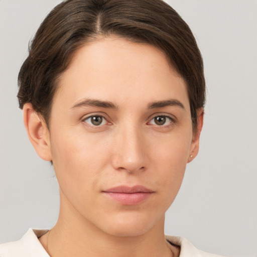 Neutral white young-adult female with short  brown hair and brown eyes