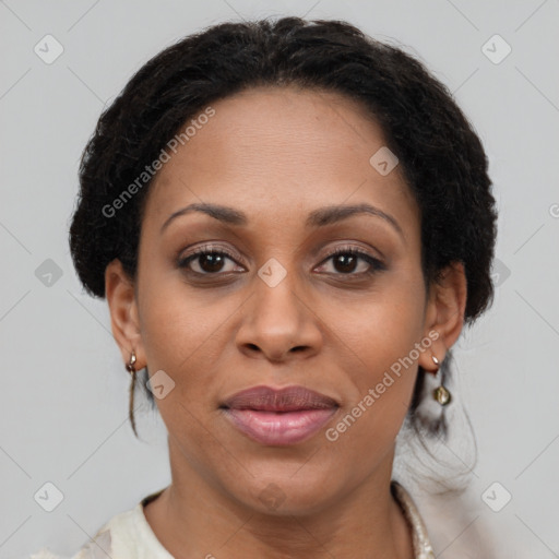 Joyful black adult female with medium  brown hair and brown eyes