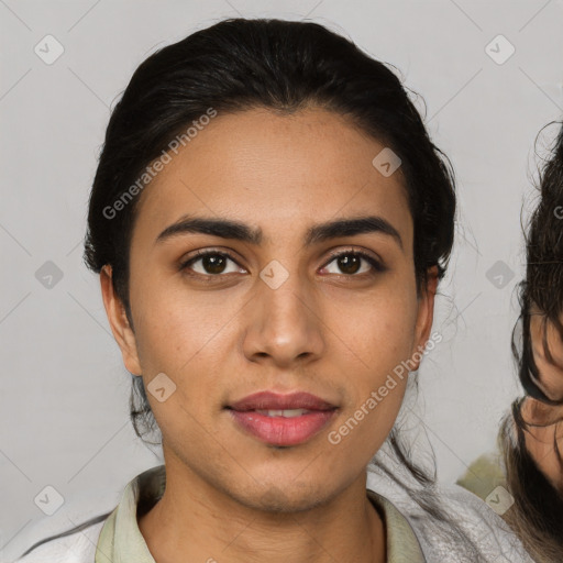 Joyful latino young-adult female with medium  black hair and brown eyes