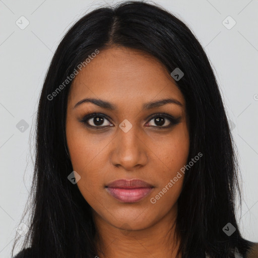 Joyful black young-adult female with long  black hair and brown eyes