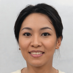 Joyful asian young-adult female with medium  black hair and brown eyes