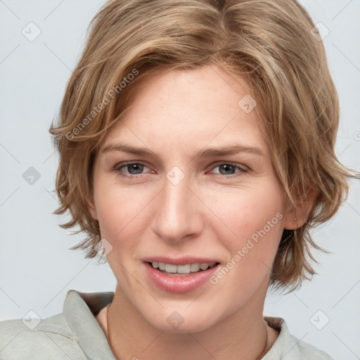 Joyful white young-adult female with medium  brown hair and blue eyes